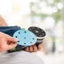 Festool excentersliber ETSC 2 125 Basic. Miljøbillede viser produktets slibepapir