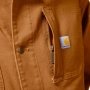 Carhartt Duck Loose Fit Chore frakke 106675BRN. Billedet viser produktets lomme med lynlås.